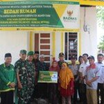 Danyonif 141/AYJP Resmikan Sekaligus Serahkan Kunci Bedah Rumah