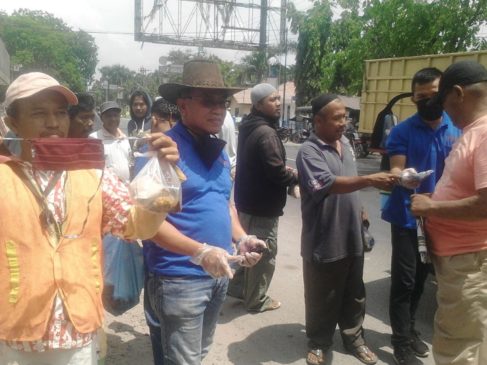 DPP PPMP Indonesia Gelar Aksi Sosial Bagi Nasi Bungkus dan Masker
