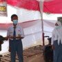 Satgas TMMD Bagikan Kouta Gratis ke Siswa-Siswi Dharma Bakti