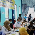 PLN ULP Kualasimpang Bagi Token Listrik Gratis Dalam Vaksinasi Massal