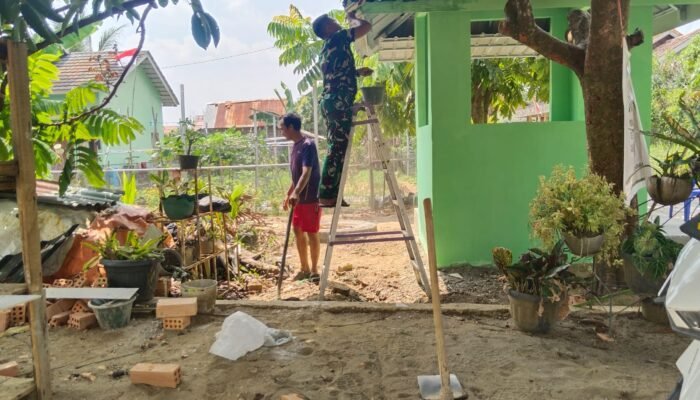 Satgas TMMD ke-129 Selesaikan Pengecatan dan Pembersihan Pos Kamling di Talang Jambe